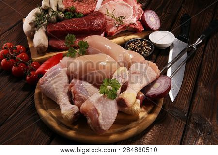 Raw Meat. Different Types Of Raw Pork Meat, Chicken And Beef With Spices And Herbs