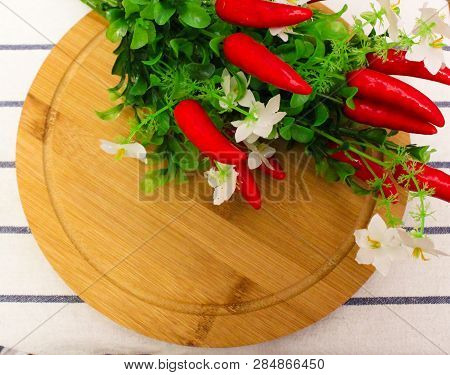 Red Round Berries, Fresh Ripe Juicy Orange Tangerines With Green Leaves, On A Round Wooden Board, Ho