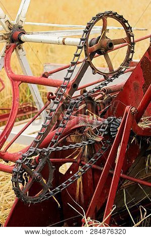 The Chain And Gears On An Old Swather