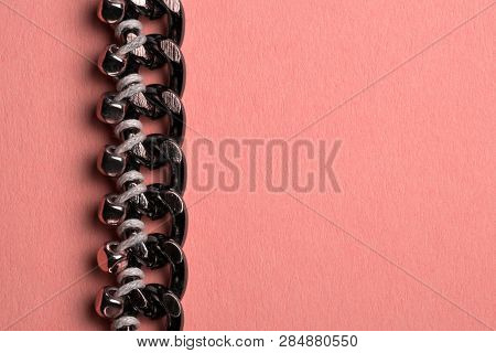 Abstract Part Of Decorated Chain. Stylish Fashion. Coral Background