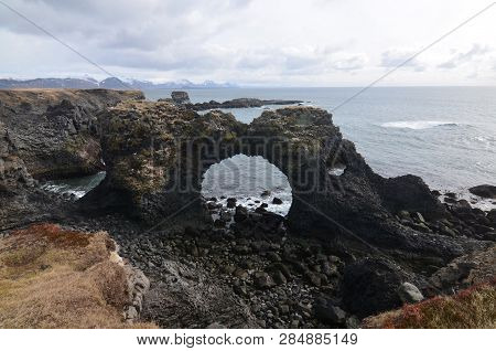 Lava Rock Arch In Arnarstapi On Iceland's Snaefelsnes Peninsula