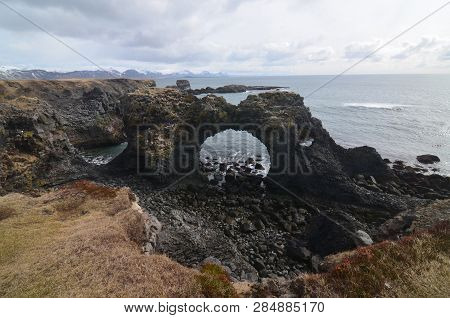 Scenic View Of Lava Arch Rock At Anarstapi In Iceland.