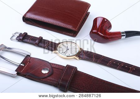 Mens Accessories For Business And Rekreation. Leather Belt, Wallet, Watch And Smoking Pipe On White 
