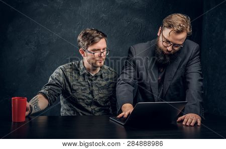 Two Programmers Are Thinking Hard, Trying To Find A Solution To The Problem In Office Against The Ba
