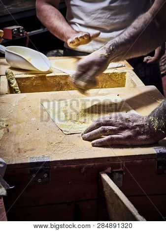 Cooks Making Tortillas On A Wooden Rustic Table.