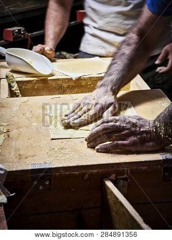 Cooks Making Tortillas On A Wooden Rustic Table.