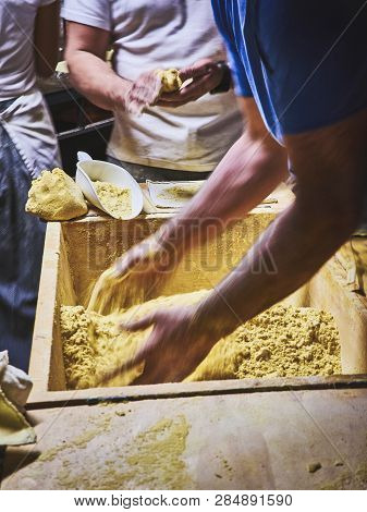Cooks Making Dough For Tortillas On A Kneading Trough.