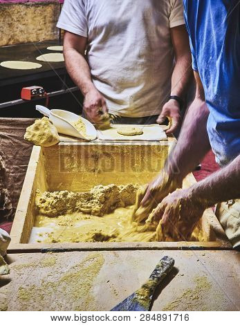 Cooks Making Dough For Tortillas On A Kneading Trough.