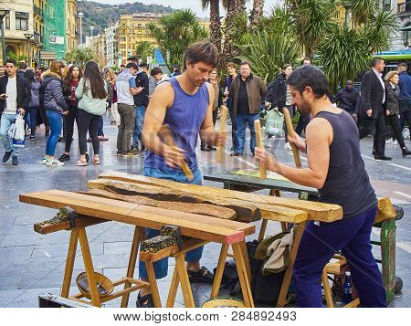 Musician Playing The Txalaparta, A Traditional Instrument Of The Basque Country. Spain.