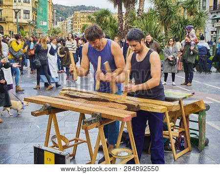 Musician Playing The Txalaparta, A Traditional Instrument Of The Basque Country. Spain.