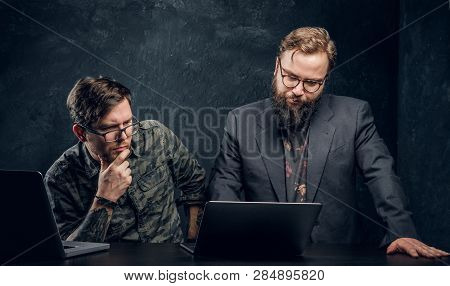 Two Programmers Are Thinking Hard, Trying To Find A Solution To The Problem In Office Against The Ba