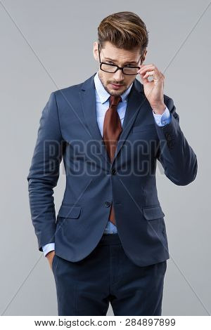 Elegant Man Wear Dark Siut And Glasses