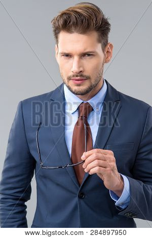 Elegant Man Wear Dark Siut And Glasses