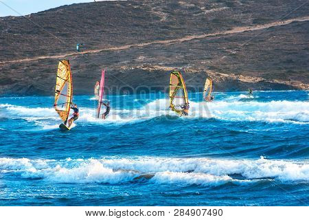 Windsurfers And Kitesurfers Ride On Prasonisi Beach (rhodes, Greece)