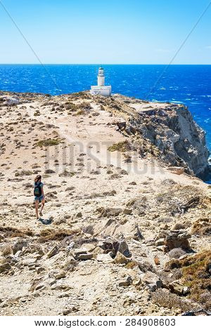 Girl Walking To White Lighthouse In Prasonisi National Park (rhodes, Greece)