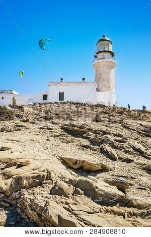 White Lighthouse And Kites In Prasonisi National Park – Southest Spot Of Island (rhodes, Greece)