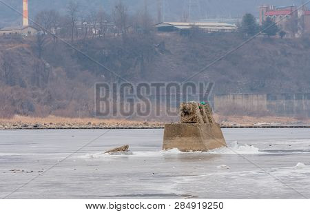 Concrete Column In Frozen River