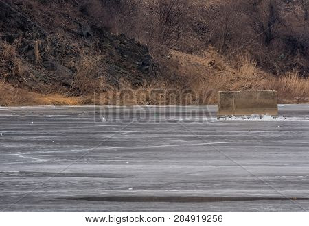 Concrete Column In Frozen River