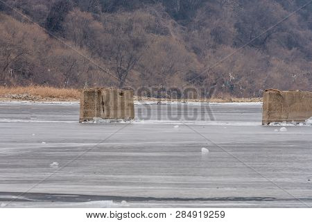 Concrete Columns In Frozen River