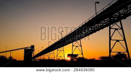 Silhouette Of A Mining Silo And Conveyor Belts