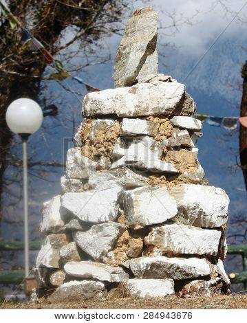 A Simple Buddhist Sputa Made By Boulder To Represent Good Luck For The Traveler.