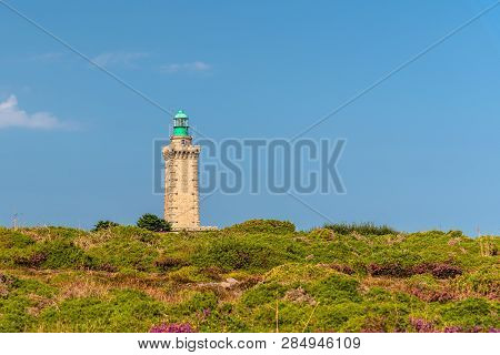Lighthouse On Cap Frehel And Violet Fields Against Sky