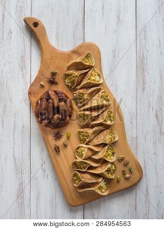 Arab Sweets. Arabian Pancake Stuffed With Sweet Cheese And Pistachios.