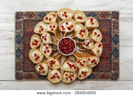 Arab Sweets. Arabian Pancake Stuffed With Sweet Cheese And Pistachios.
