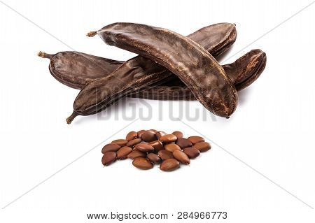 Carobs Pod With Beans Isolated On White Background