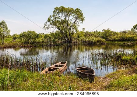 Old Wooden Boats On The Teteriv River In The Kyiv (kiev) Region In Ukraine - Scenic Countryside