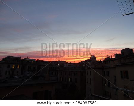 Genova, Italy - 02/12/2019: An Amazing Caption Of The Sunset Over The City Of Genoa In Winter Days C