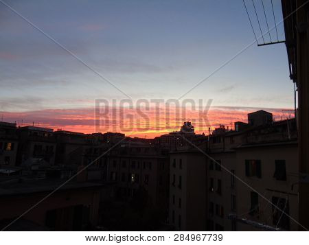 Genova, Italy - 02/12/2019: An Amazing Caption Of The Sunset Over The City Of Genoa In Winter Days C