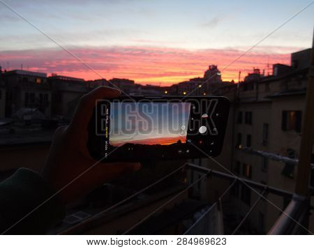 Genova, Italy - 02/12/2019: An Amazing Caption Of The Sunset Over The City Of Genoa In Winter Days C