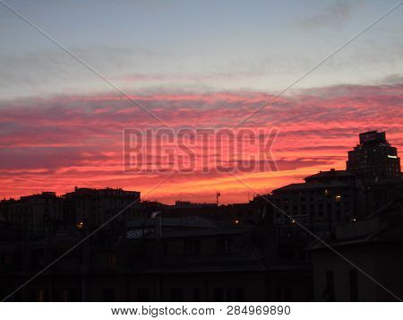 Genova, Italy - 02/12/2019: An Amazing Caption Of The Sunset Over The City Of Genoa In Winter Days C