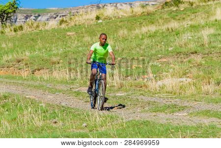 African Children Riding A Bike In Rural A Village