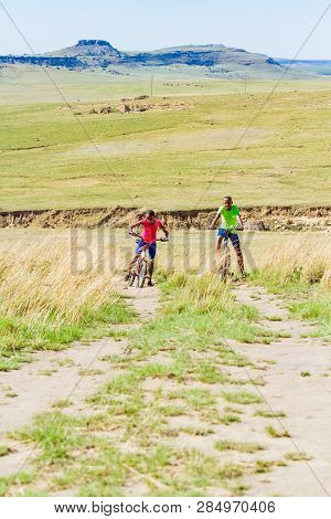 African Children Riding A Bike In Rural A Village