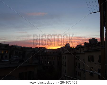Genova, Italy - 02/12/2019: An Amazing Caption Of The Sunset Over The City Of Genoa In Winter Days C