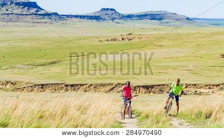 African Children Riding A Bike In Rural A Village