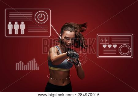 Hustle To Gain More Muscle. Sportswoman Standing Concentrated In Gym Gloves Over Red Background.. Ga