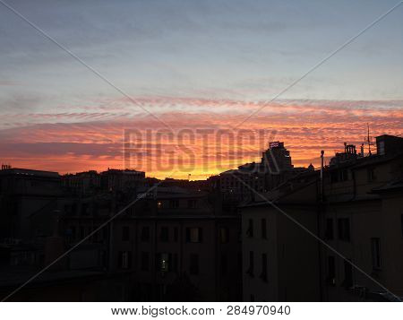 Genova, Italy - 02/12/2019: An Amazing Caption Of The Sunset Over The City Of Genoa In Winter Days C