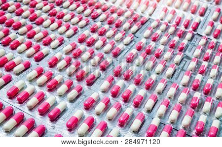 Closeup Pink-white Antibiotic Capsule Pills In Blister Pack. Antimicrobial Drug Resistance. Pharmace