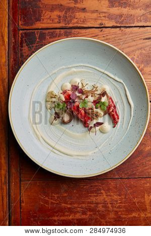 gourmet dish with praws, shitake mushrooms and cauliflower