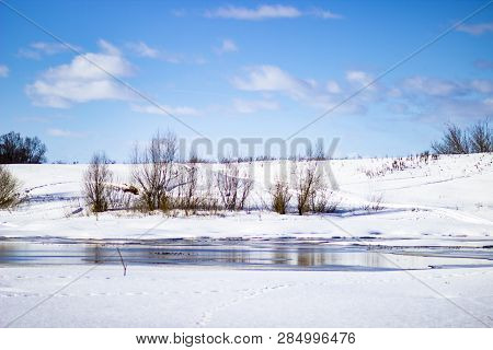 White Snow On A Small River In Russia In Winter