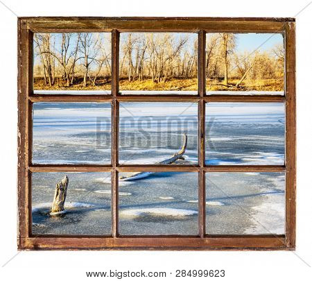Frozen lake in northern Colorado as seen from a vintage window