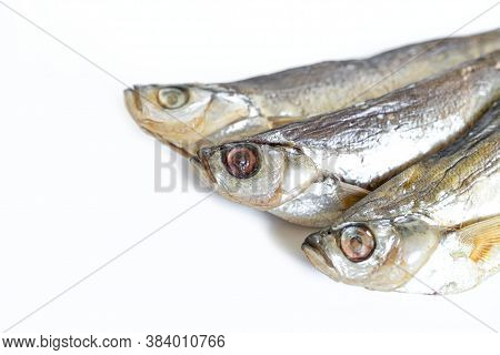 Isolated Close Up Top View Three Dried Salted Chehon Fish On A White Background