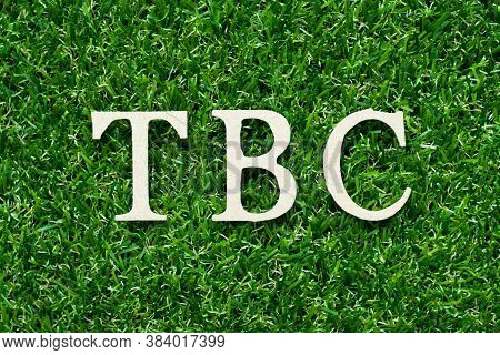 Wood Alphabet Letter In Word Tbc (abbreviation Of To Be Confirmed Or Continued) On Green Grass Backg