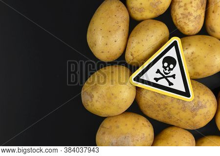 Concept For Unhealthy Or Toxic Substances In Food Like Solanin Or Pesticide Residues With Skull Warn