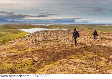 Helgafell, Iceland- 26 August 2015: People In The Holy Mountain And Breathtaking Panoramic View Acro
