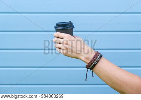 Hippie Woman Hand Wearing Boho Leather Bracelets On A Wrist Holding Hot Coffee Takeaway Paper Cup, F