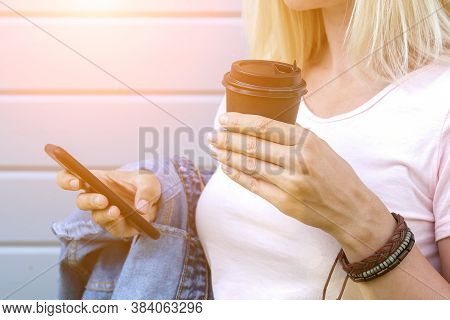 Hippie Woman Wearing Boho Leather Bracelets On A Wrist Holding A Takeaway Paper Cup Of Coffee And A 